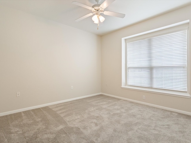 carpeted empty room with ceiling fan