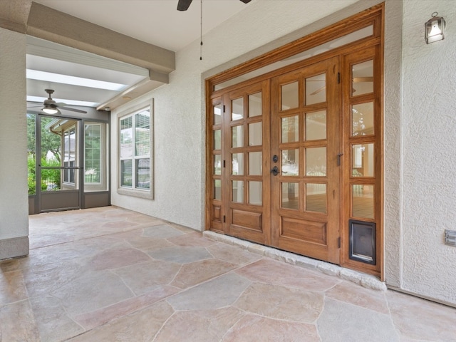 interior space featuring french doors and ceiling fan