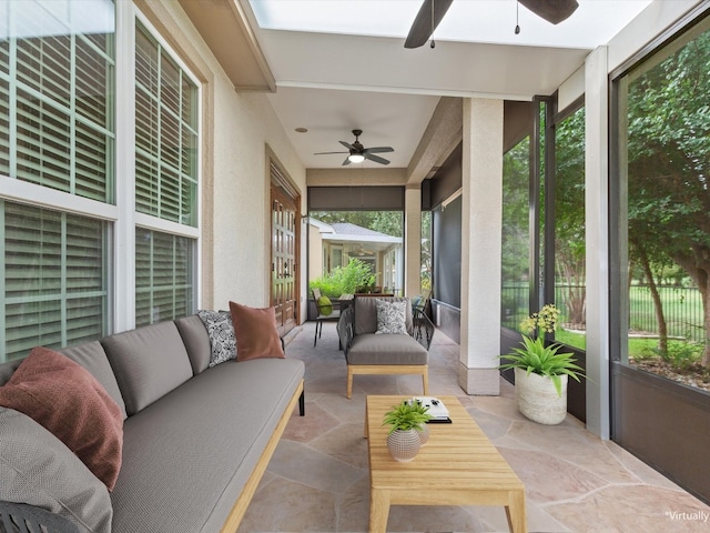 sunroom with ceiling fan