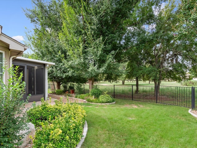 view of yard with a sunroom