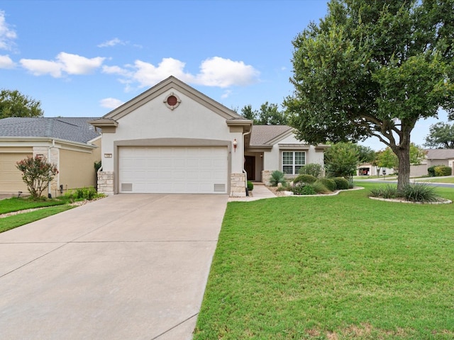 view of front of home featuring a garage and a front lawn