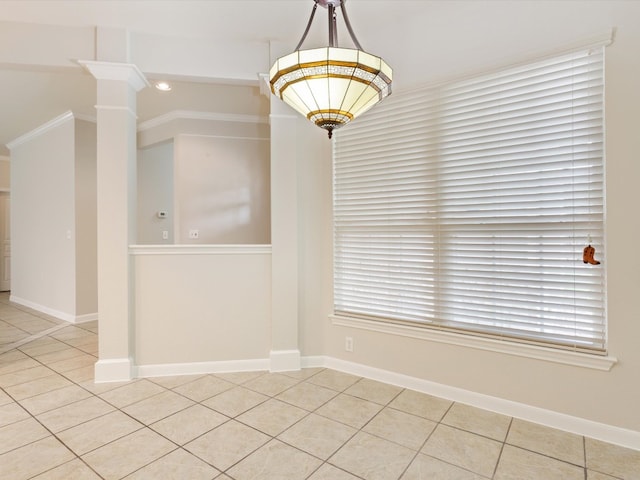 spare room with crown molding and light tile patterned flooring