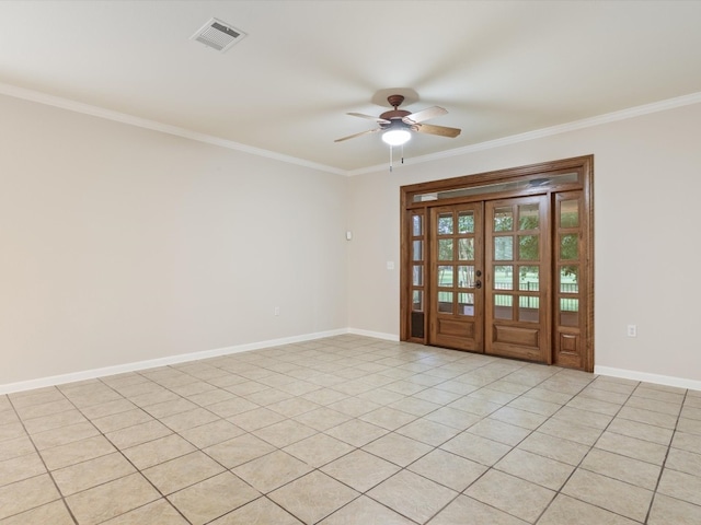 tiled spare room with crown molding, french doors, and ceiling fan