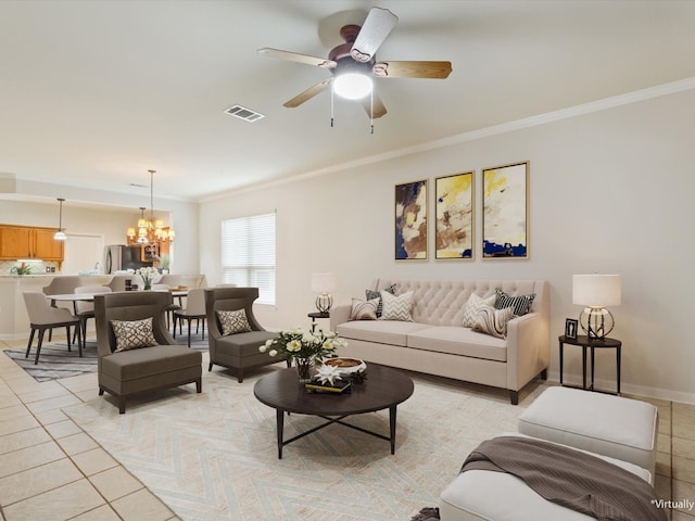 living room featuring light tile patterned floors, ornamental molding, and ceiling fan with notable chandelier