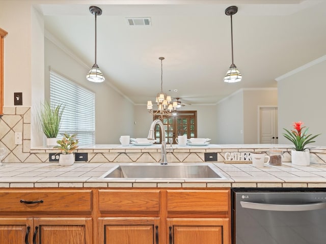 kitchen with backsplash, tile counters, sink, and stainless steel dishwasher