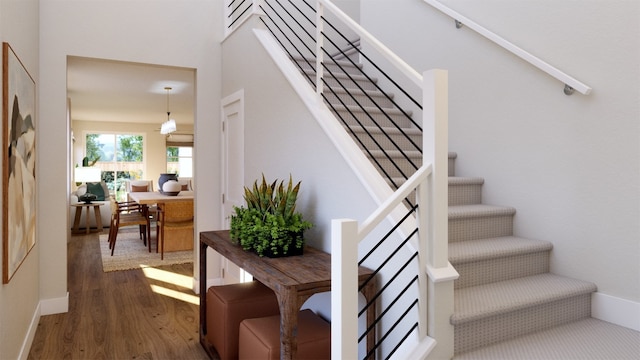 stairs with wood-type flooring