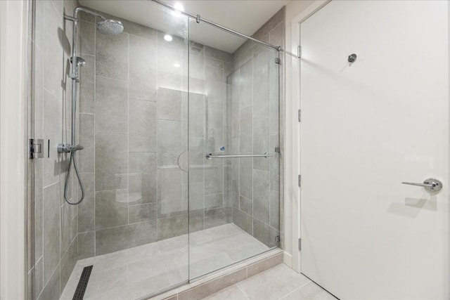 44 E Ave Unit 1709, Austin, TX 78701 - bathroom with a stall shower and tile patterned flooring