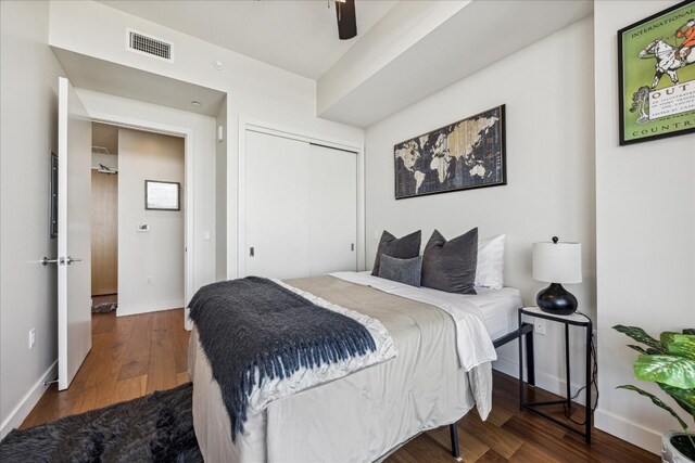 bedroom featuring a closet, wood-type flooring, and ceiling fan