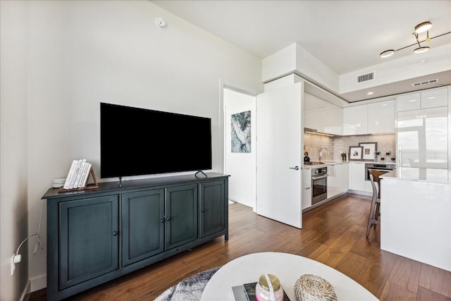44 E Ave Unit 1709, Austin, TX 78701 - living area featuring dark wood finished floors