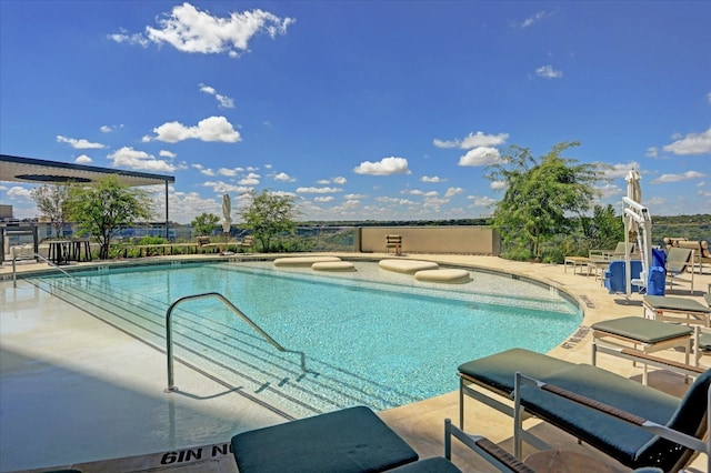 view of pool featuring a patio area