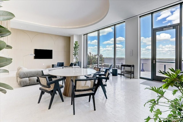44 E Ave Unit 1709, Austin, TX 78701 - dining area with a wall of windows and a water view