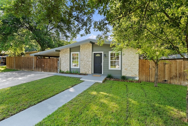 single story home with a carport and a front yard