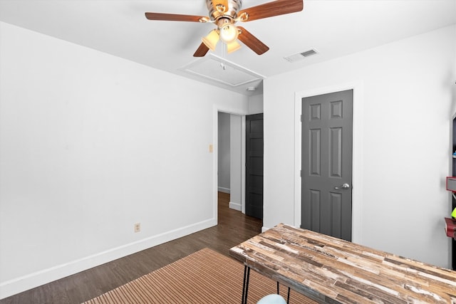 unfurnished bedroom with ceiling fan and dark hardwood / wood-style floors