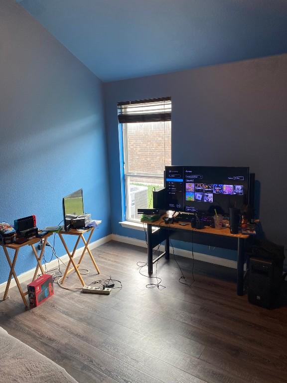 home office with wood finished floors and baseboards