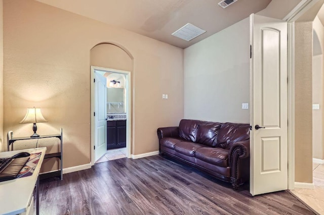 206 Swenson Dr, Hutto, TX 78634 - living room featuring wood finished floors and arched walkways