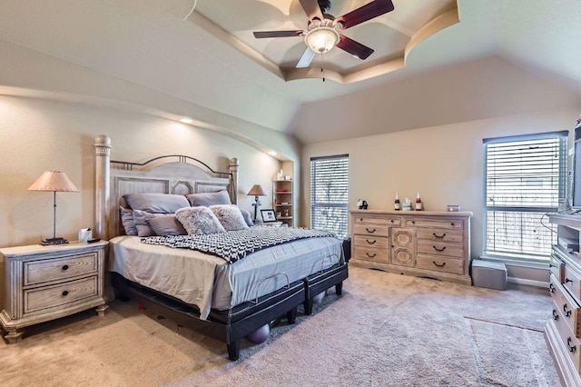206 Swenson Dr, Hutto, TX 78634 - bedroom featuring light carpet, lofted ceiling, ceiling fan, and a raised ceiling