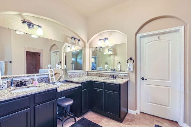 206 Swenson Dr, Hutto, TX 78634 - bathroom with double vanity and tile patterned flooring