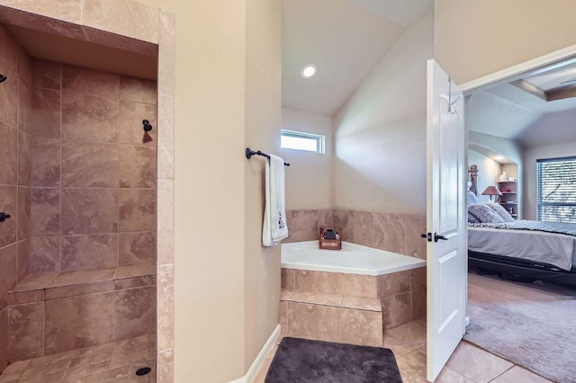 206 Swenson Dr, Hutto, TX 78634 - bathroom with ensuite bathroom, a garden tub, lofted ceiling, a tile shower, and healthy amount of natural light