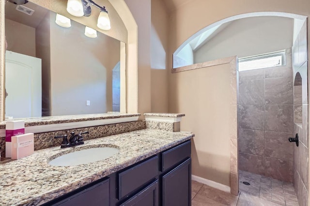 206 Swenson Dr, Hutto, TX 78634 - full bathroom featuring walk in shower, vanity, and tile patterned floors