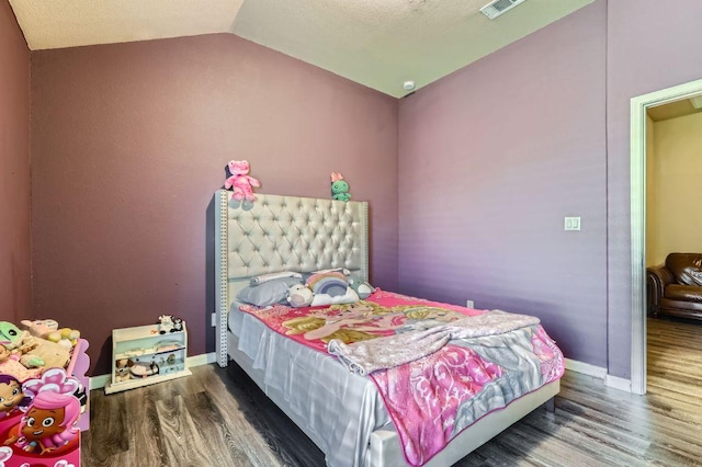 206 Swenson Dr, Hutto, TX 78634 - bedroom featuring wood finished floors and lofted ceiling