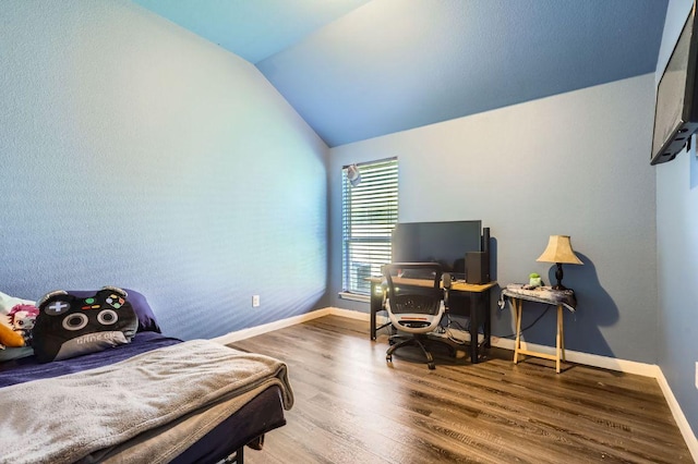206 Swenson Dr, Hutto, TX 78634 - bedroom featuring vaulted ceiling and wood finished floors