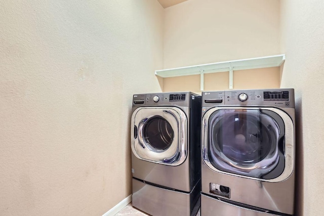 206 Swenson Dr, Hutto, TX 78634 - laundry room with washer and dryer and baseboards