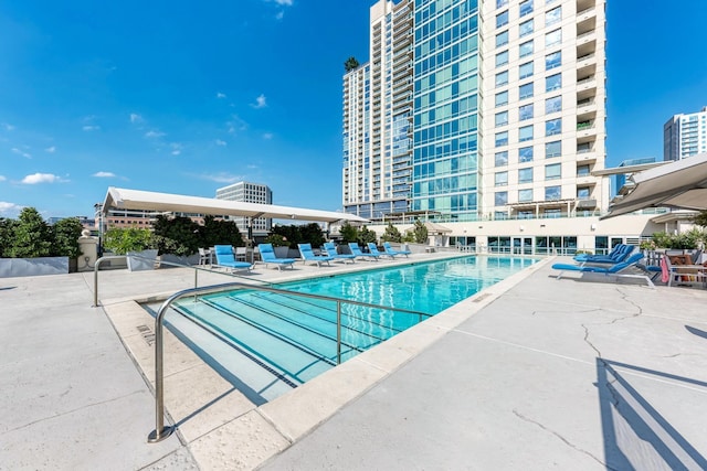 community pool featuring a patio area