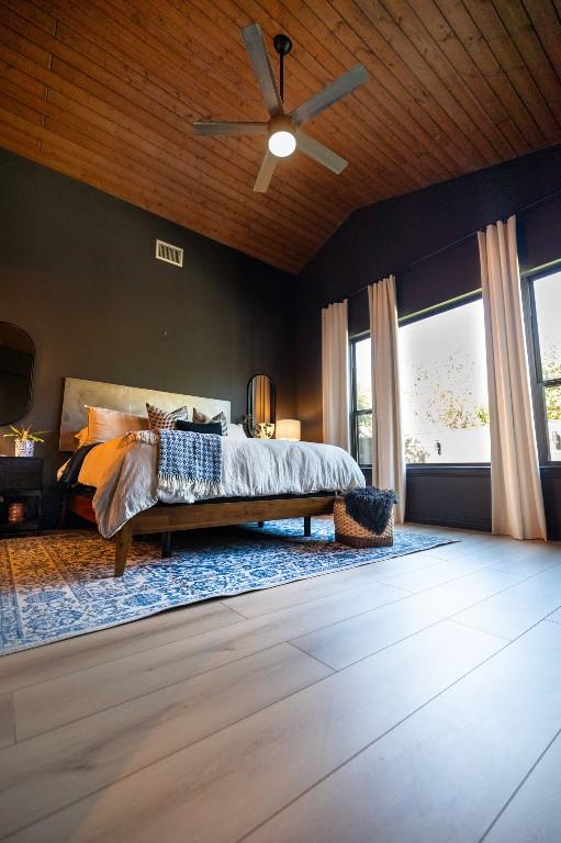 bedroom with ceiling fan, wooden ceiling, visible vents, access to exterior, and vaulted ceiling