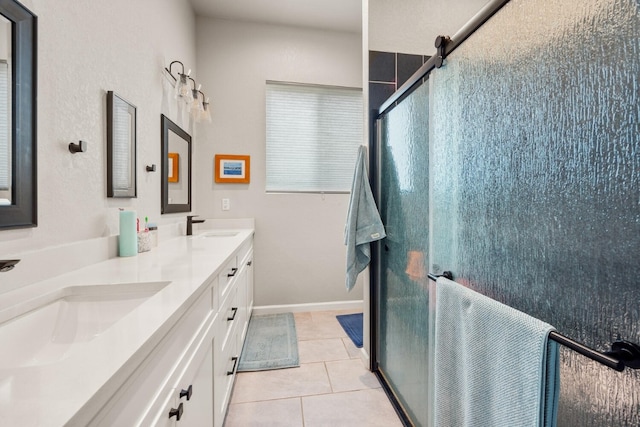 103 Hans Bell Dr, Blanco, TX 78606 - full bathroom with double vanity, a stall shower, and tile patterned floors