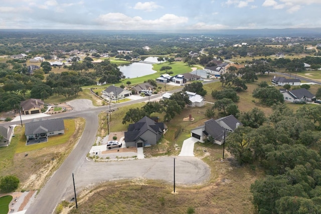 103 Hans Bell Dr, Blanco, TX 78606 - aerial overview of property's location with a nearby body of water and nearby suburban area