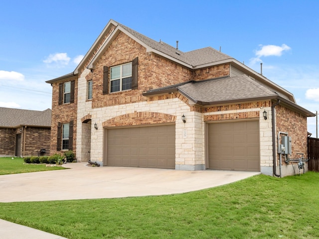 view of front of home with a garage and a front yard