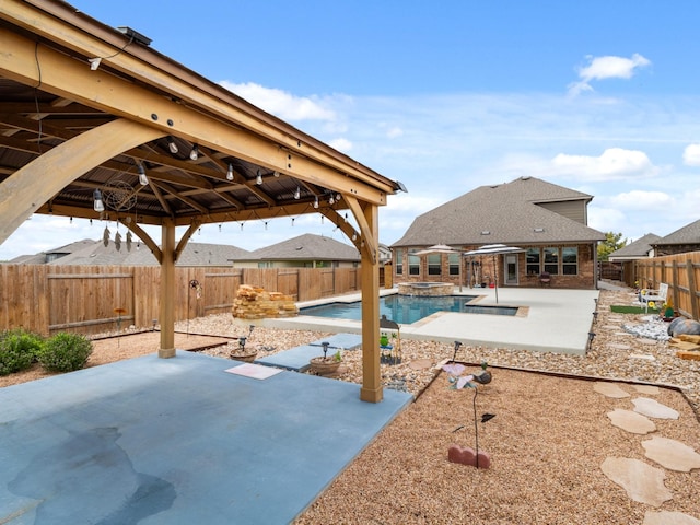 view of pool with an in ground hot tub and a patio