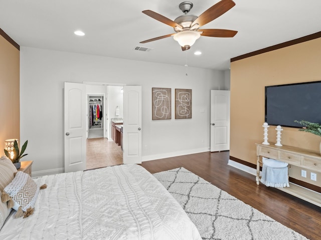 bedroom with dark hardwood / wood-style floors and ceiling fan