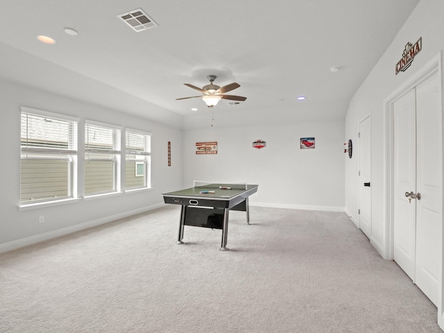 playroom with light colored carpet and ceiling fan