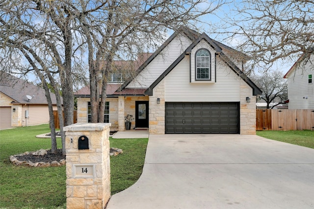 view of front of property with a front yard and a garage