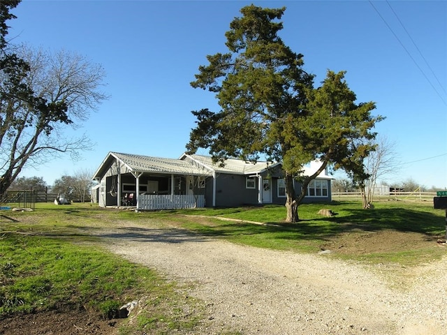 view of front of home featuring a porch and a front lawn