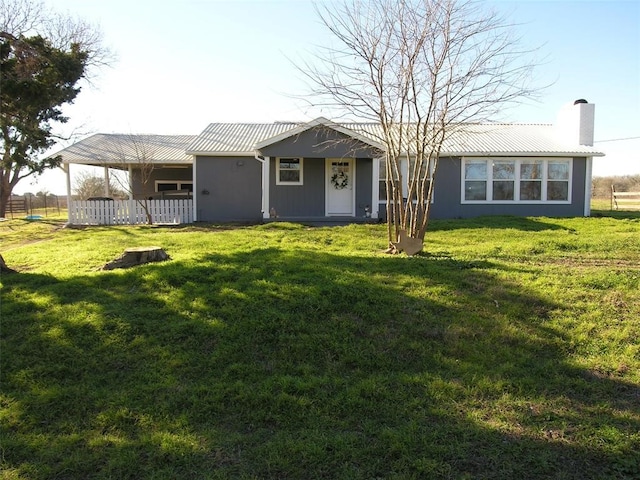 back of house featuring a lawn