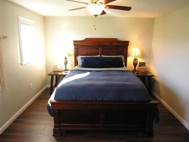 bedroom with ceiling fan and dark hardwood / wood-style flooring