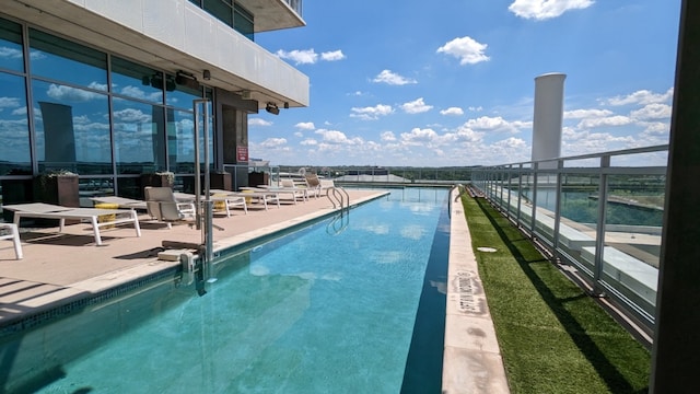 view of swimming pool with a patio area