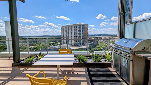 balcony featuring area for grilling