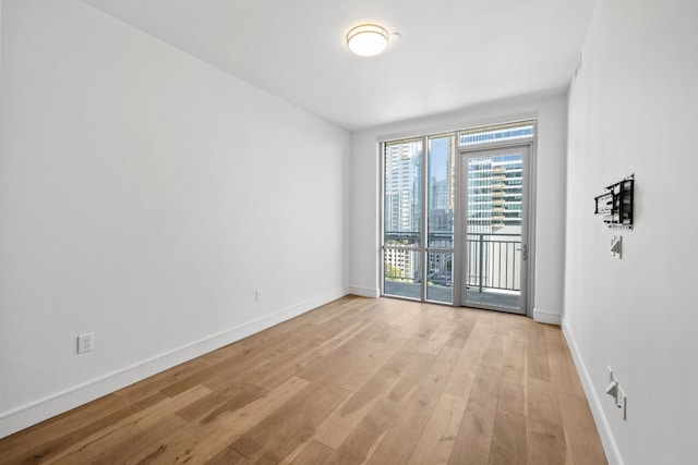 spare room featuring light hardwood / wood-style floors