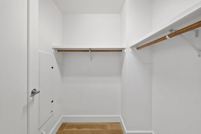 spacious closet featuring hardwood / wood-style flooring