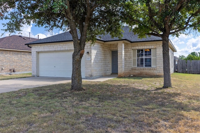 ranch-style home featuring a garage and a front lawn