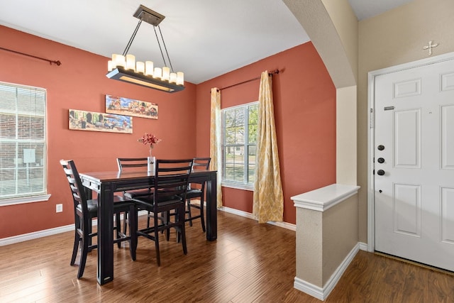 dining area with dark wood-type flooring