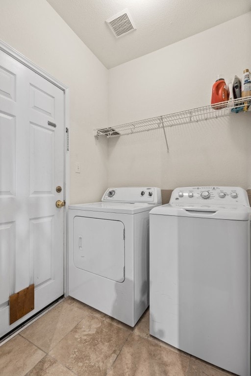 clothes washing area featuring washing machine and dryer