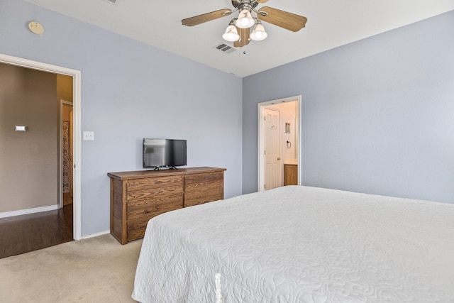 bedroom featuring light colored carpet and ceiling fan