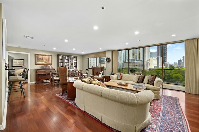 living room with dark hardwood / wood-style floors