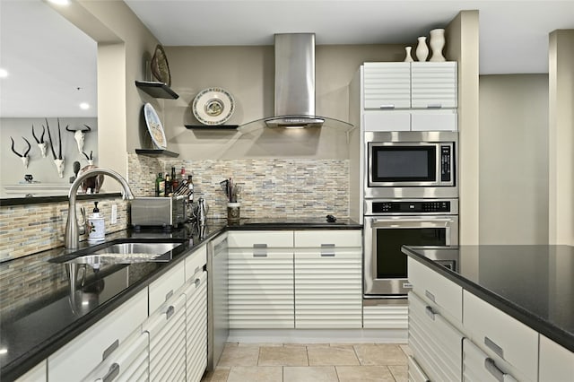 40 N Interstate Highway 35 Unit 8C1, Austin, TX 78701 - kitchen with appliances with stainless steel finishes, wall chimney exhaust hood, open shelves, tasteful backsplash, and white cabinets