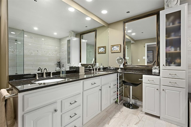 40 N Interstate Highway 35 Unit 8C1, Austin, TX 78701 - bathroom with double vanity, recessed lighting, and tiled shower