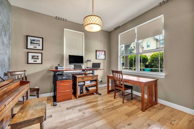 office space with light hardwood / wood-style flooring